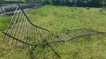 In May, this is what our fence looked like when some kid drove out of the Carroll PE Center parking lot.