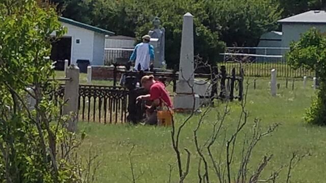 e Clampus Vitus members (Clampers) cleaning and removing weeds from the cemetery.