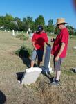 ECV members contemplating repair of sunken grave 3 Aug2019